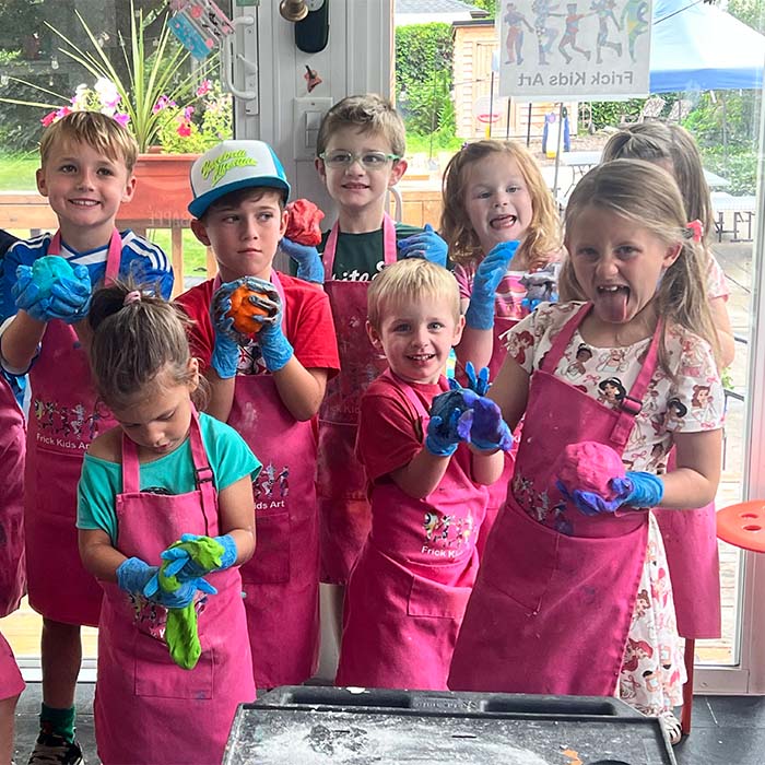 Kids playing with dough at birthday party